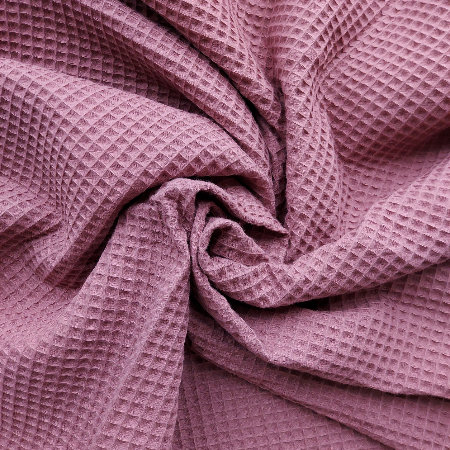 Close-up of waffle-textured pink fabric