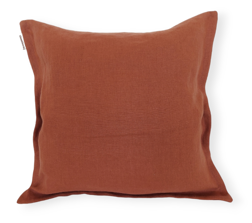 Linen cushion cover in warm cinnamon color, featuring a hidden zipper and a delicate small flange for added elegance.
