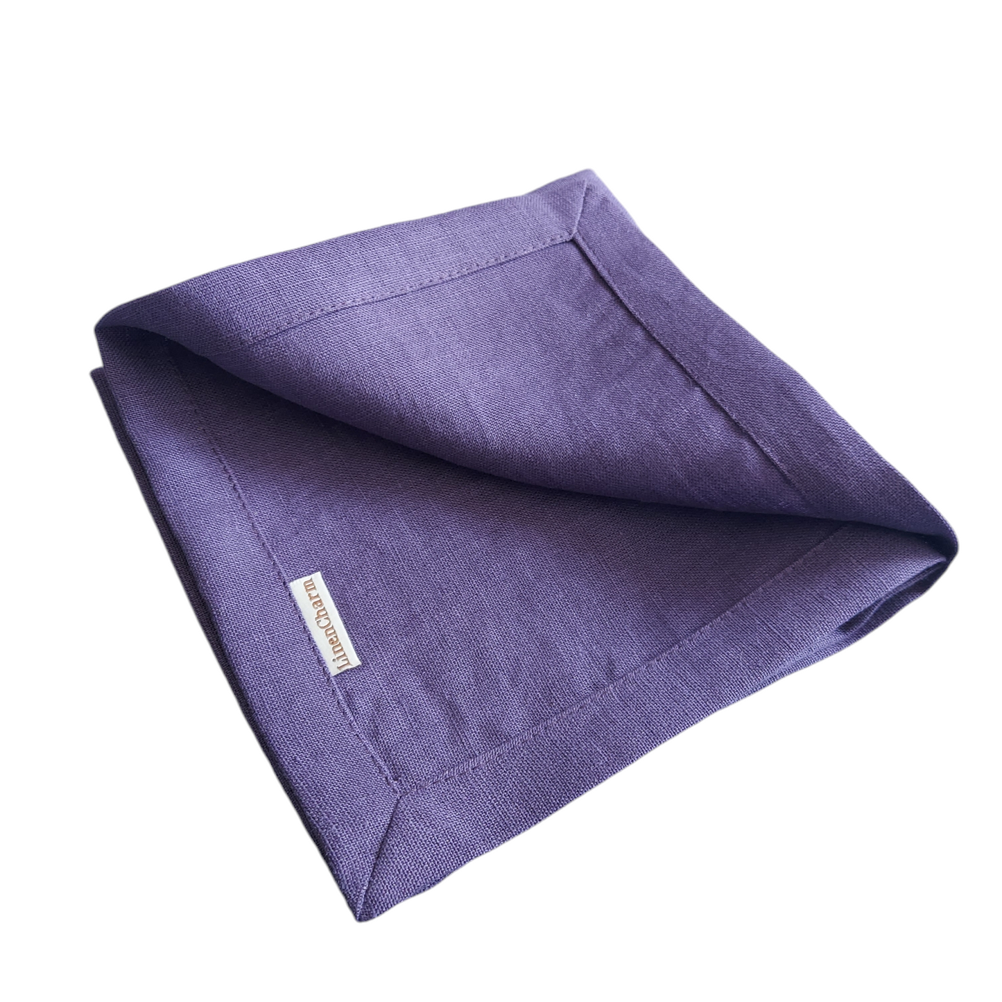 Eggplant purple linen napkin folded for wedding table setting