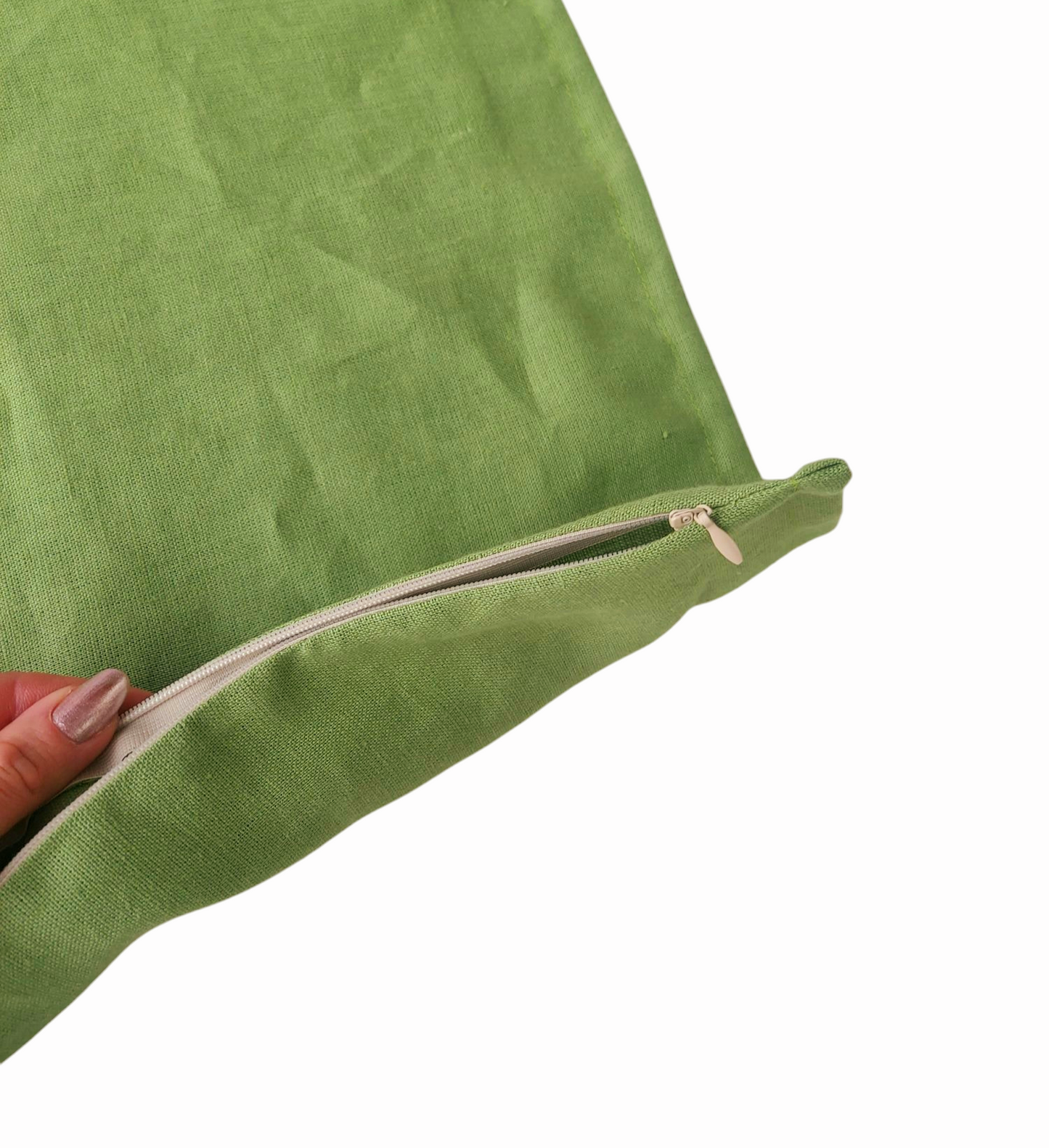 Elegant linen throw pillow cover in a natural green hue, designed with a small flange trim and hidden zipper