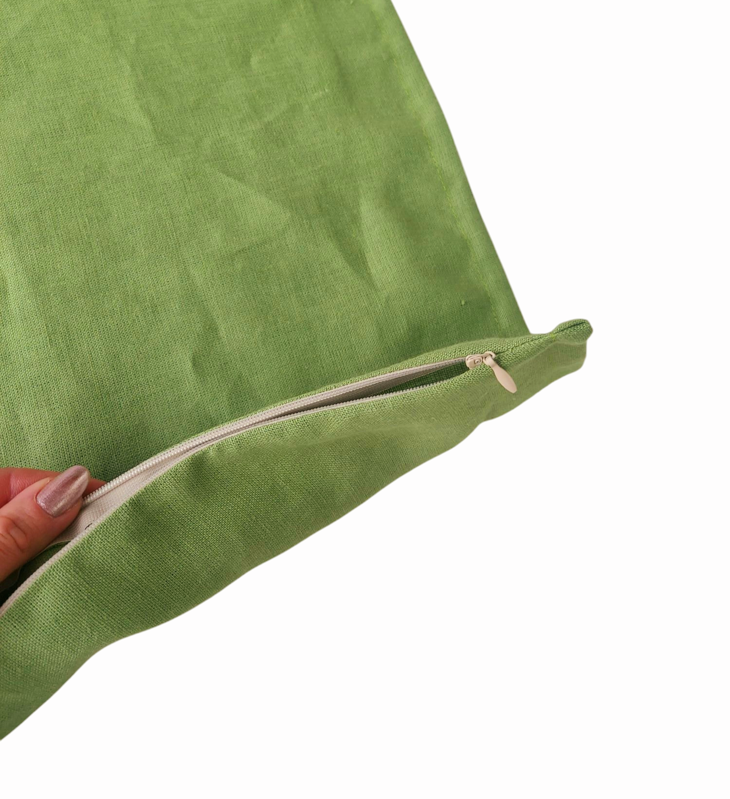 Elegant linen throw pillow cover in a natural green hue, designed with a small flange trim and hidden zipper