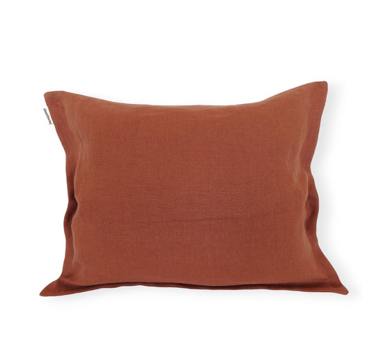 Decorative throw pillow cover in cinnamon linen with a refined small flange and an invisible zipper for a seamless look.