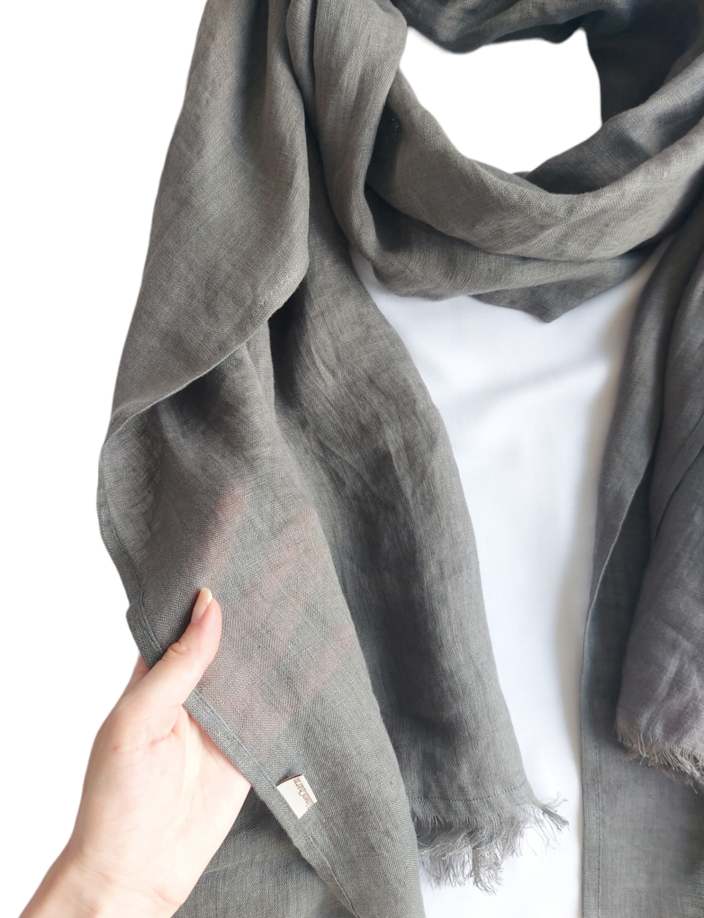 Dark grey softened linen wrap on table – unisex design