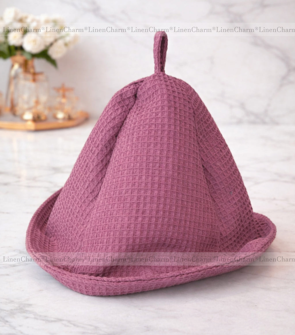 Breathable old rose cotton sauna cap with a textured waffle weave finish.