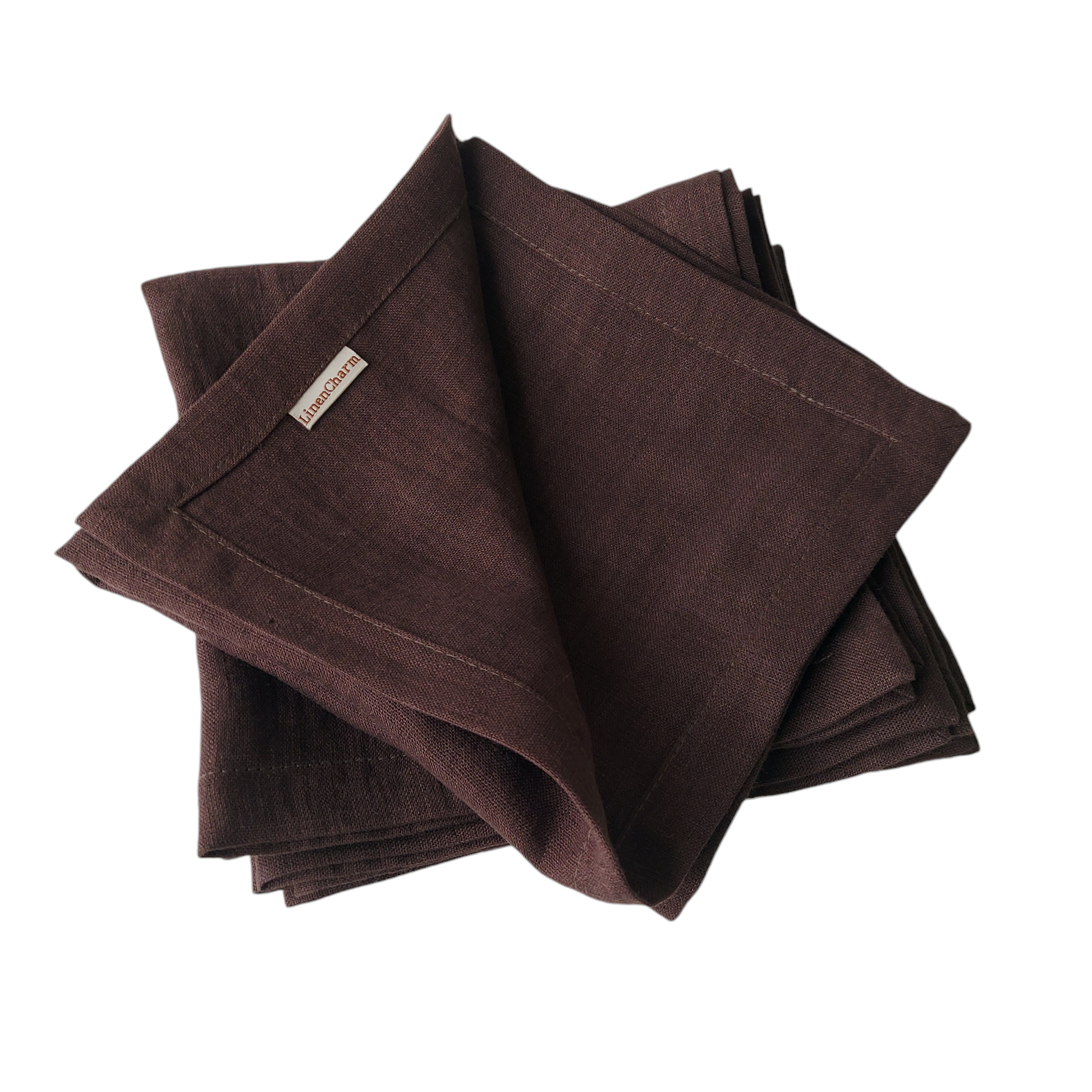 Rustic wedding table setting with chocolate linen napkins