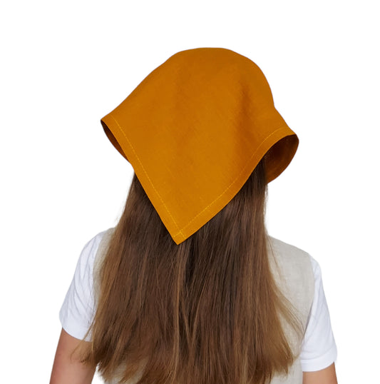 Model wearing mustard linen bandana styled as a headscarf – breathable and handmade