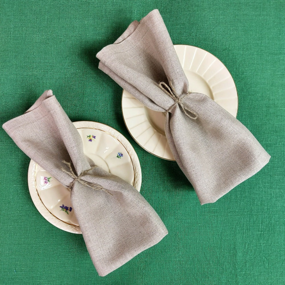 Minimalist table with natural linen napkins and ceramic plates