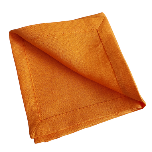 Orange linen napkins folded flat – 205g/m² handmade style