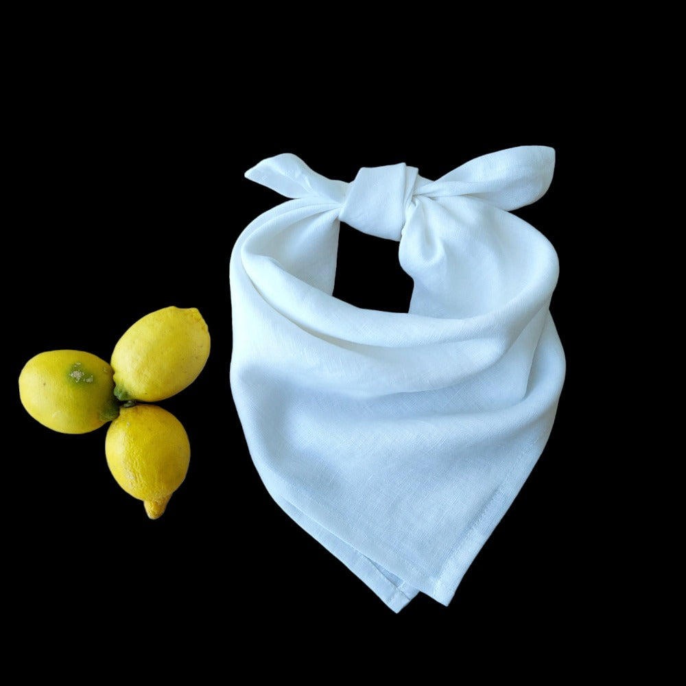 Model wearing white linen headscarf handmade from natural fabric