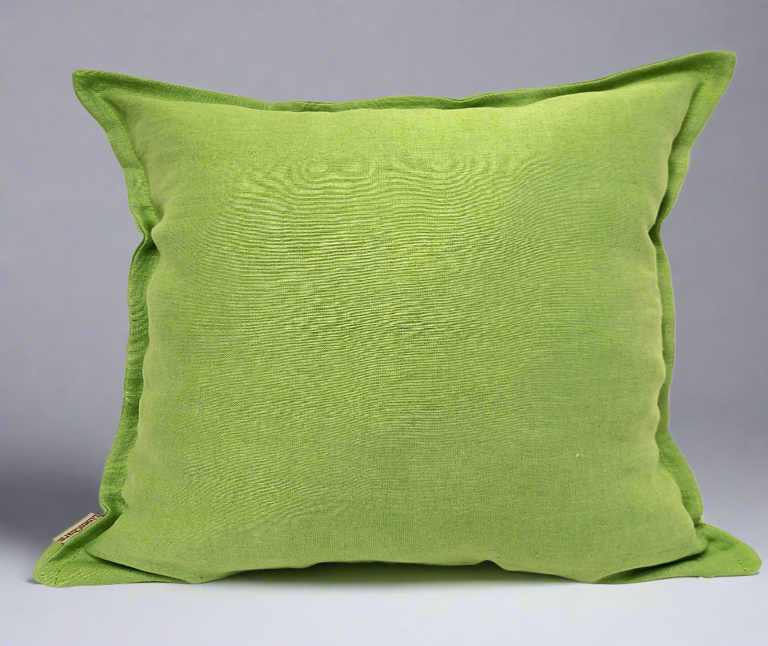 Fern green linen cushion cover with a small decorative flange and hidden zipper, perfect for enhancing home décor.