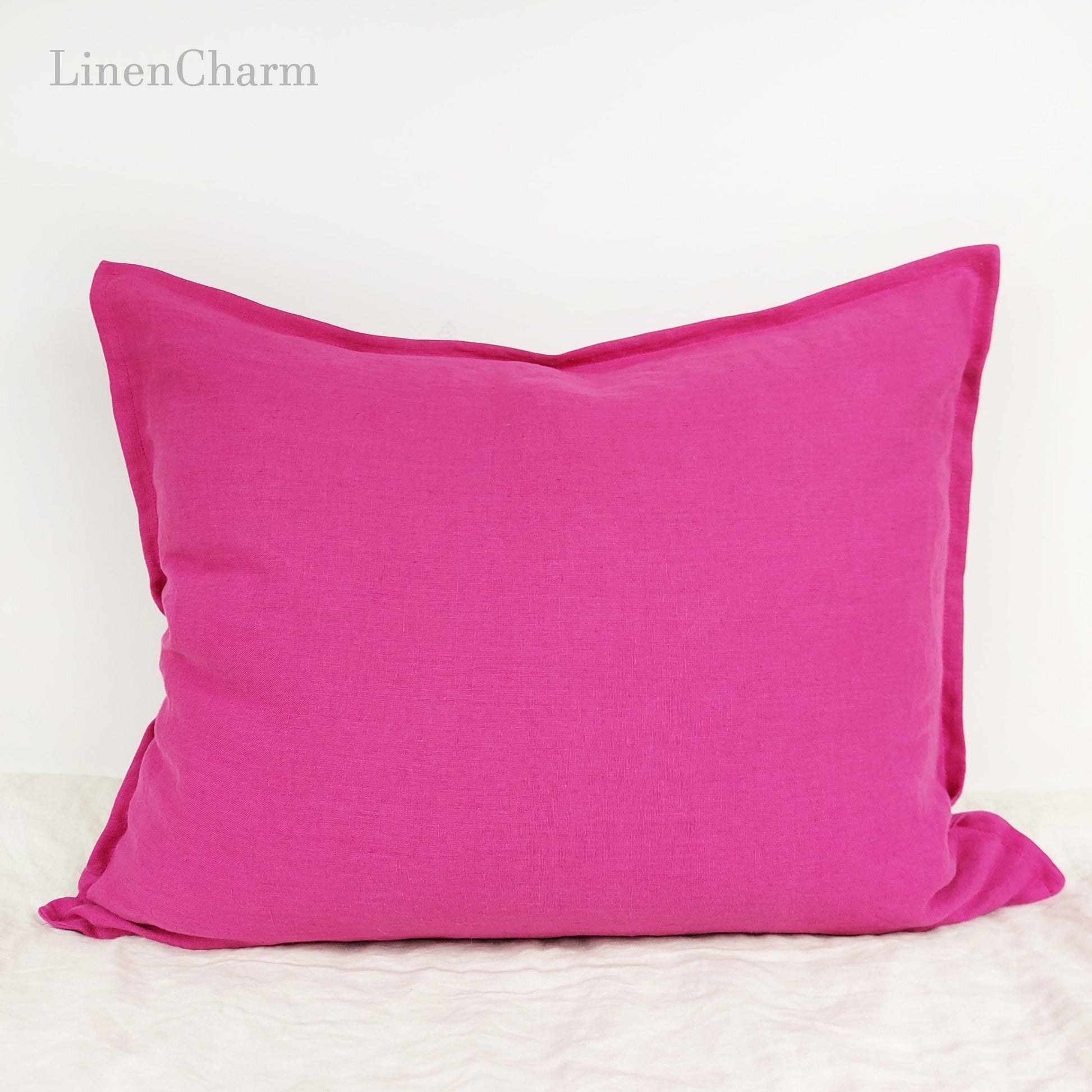 Handcrafted linen throw pillowcase in rich fuchsia, made from pure European linen with an invisible zipper closure.