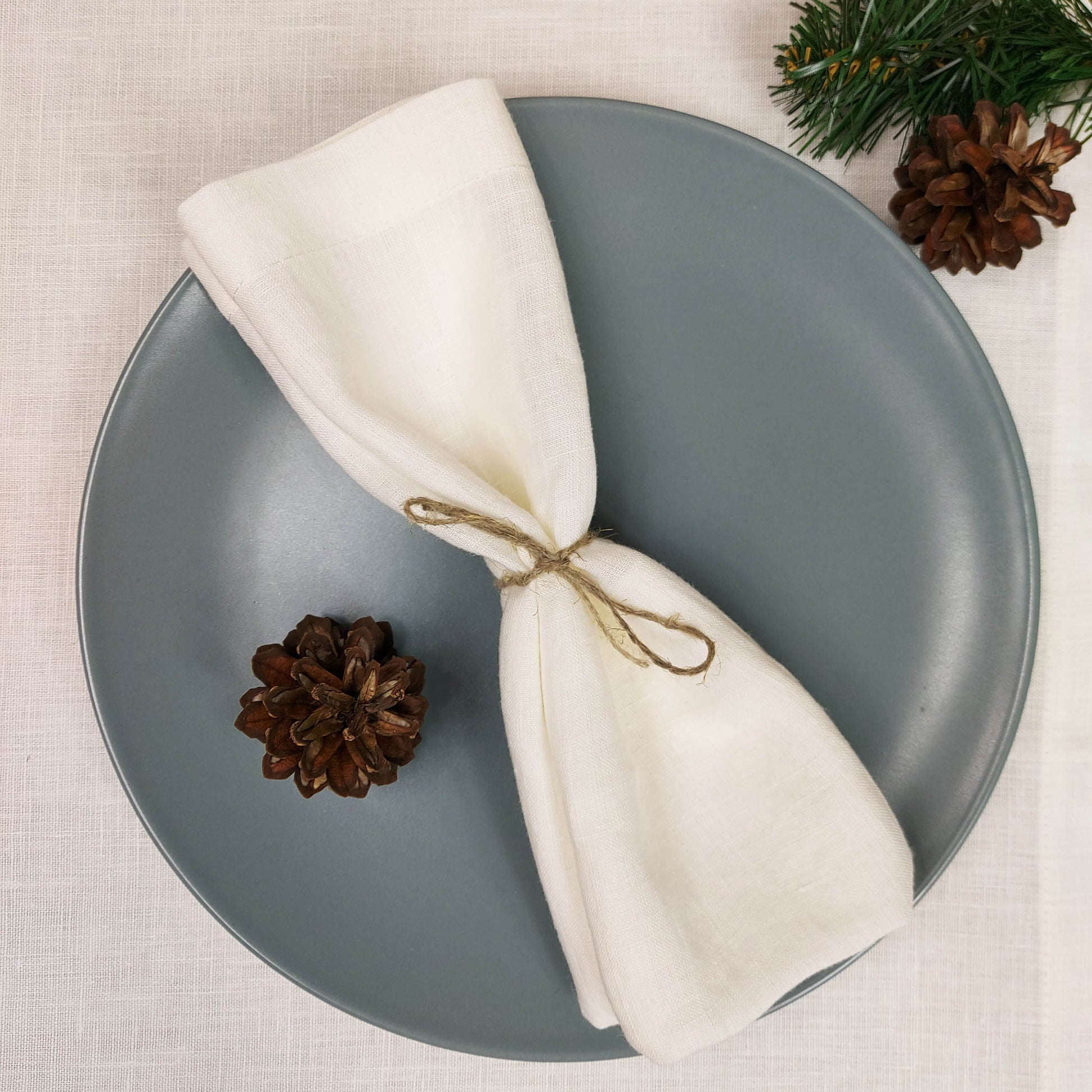 Flat lay of ecru linen napkins – 100% pure linen for weddings