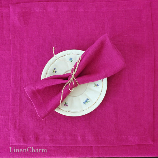 Flat lay of fuchsia 100% linen napkins – 205g/m² handmade cloth