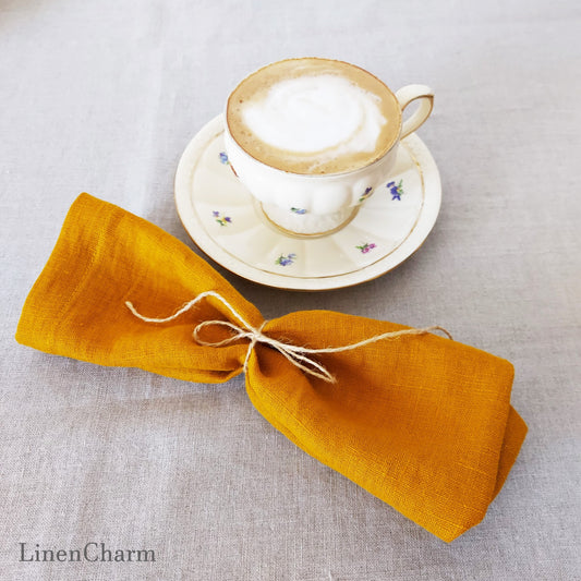 Flat lay of mustard linen napkins – handmade, 100% linen