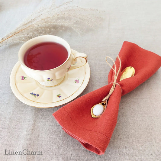 Flat lay of red brick linen napkins – 100% linen handmade 205g/m²