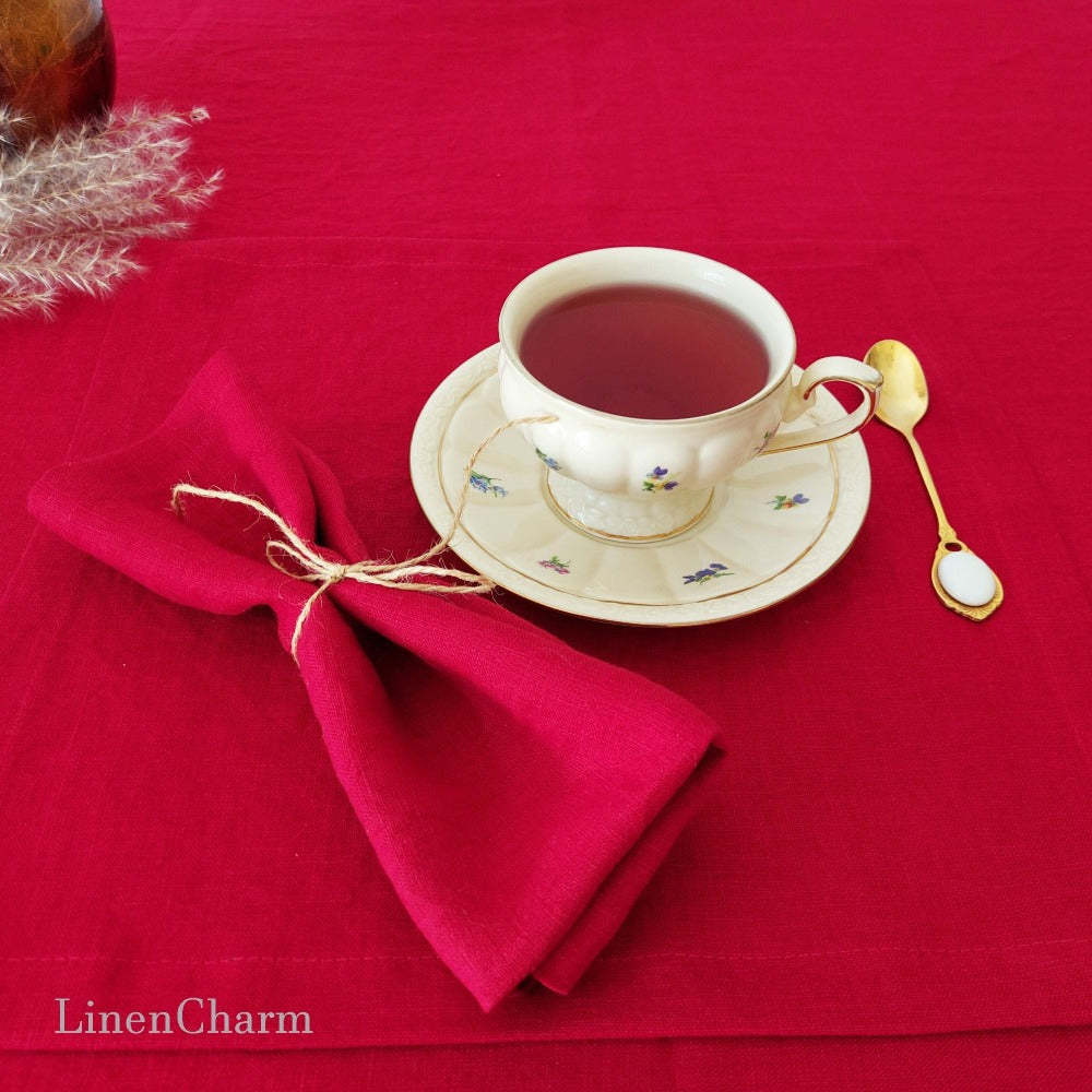 Festive holiday table setting with red linen napkins