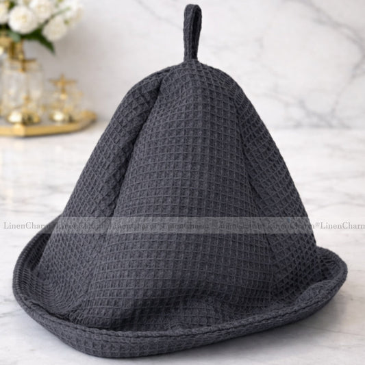 Front view of an anthracite sauna hat made from 100% waffle cotton for sauna and spa use.