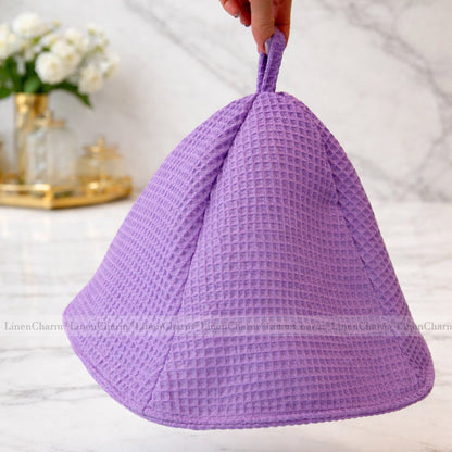 Front view of a lilac waffle cotton sauna hat made from 100% cotton for sauna and spa use.