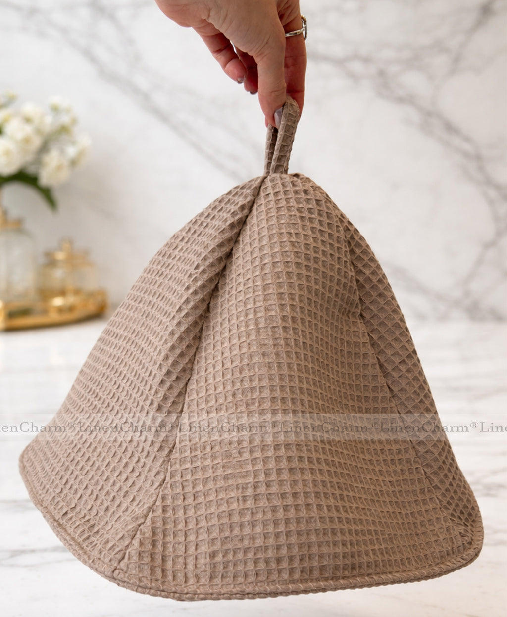 Elegant taupe spa hat crafted from soft waffle weave cotton with a practical hanging loop.