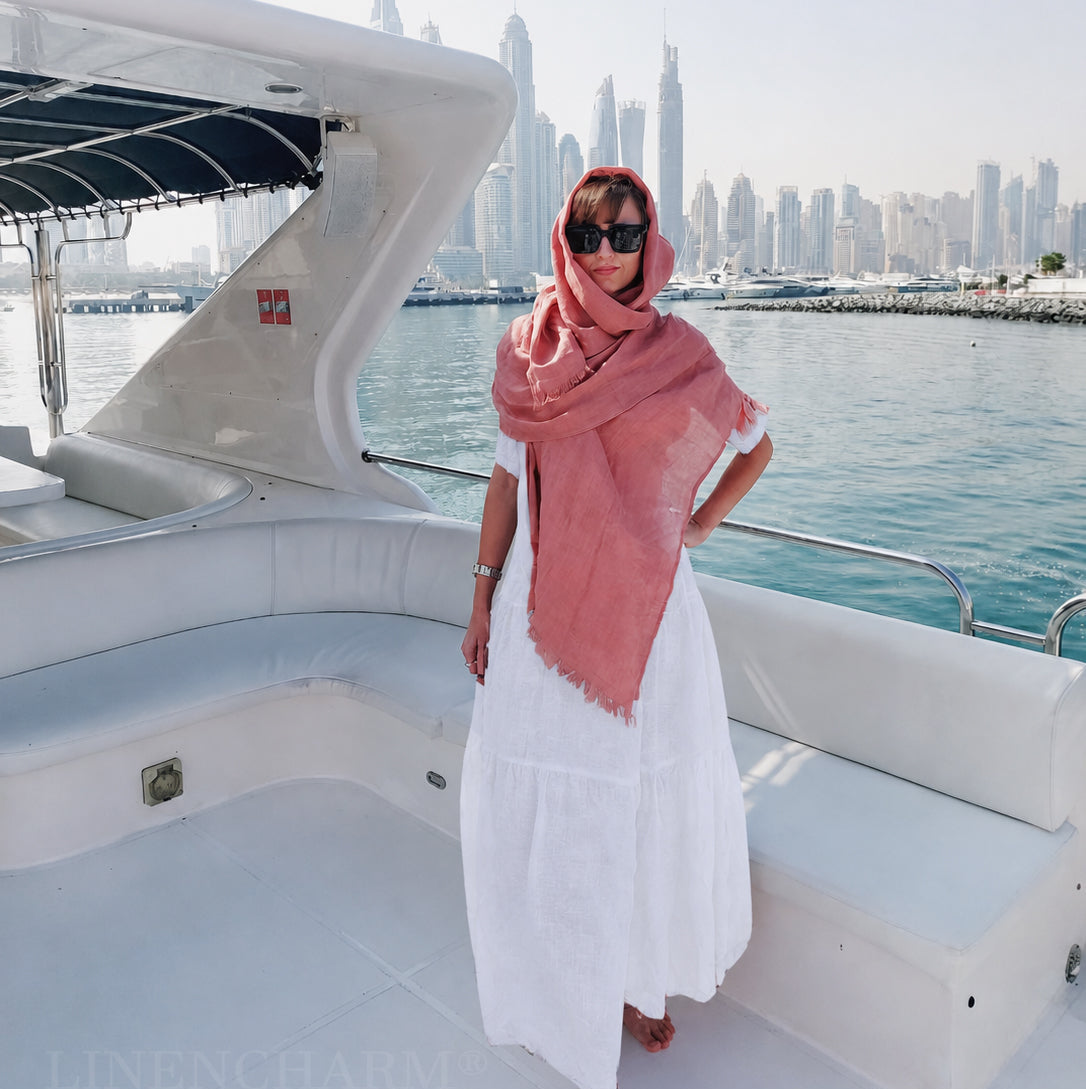 Woman on a boat with a city skyline in the background
