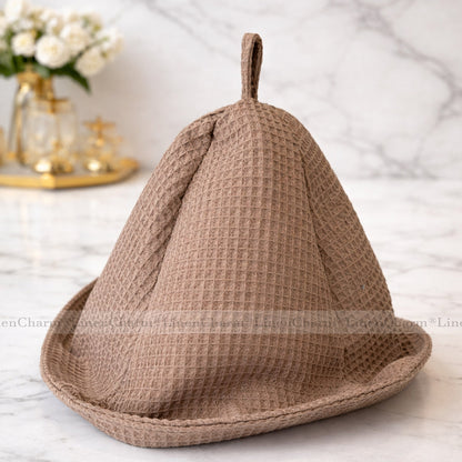 Taupe sauna hat made from natural waffle cotton with a practical hanging loop.