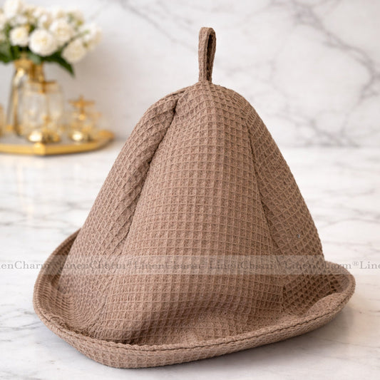 Taupe sauna hat made from natural waffle cotton with a practical hanging loop.