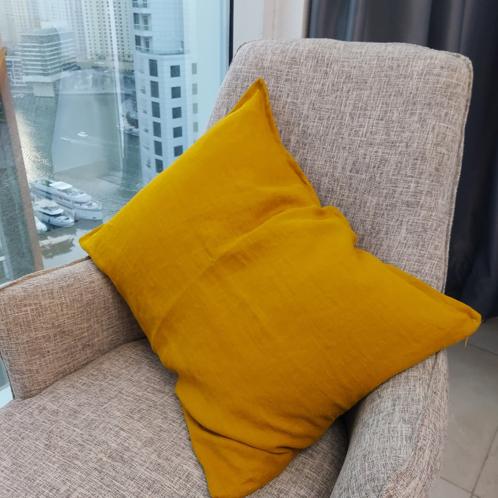Handmade mustard throw pillow cover made from 100% linen, featuring a discreet zipper for a seamless finish.