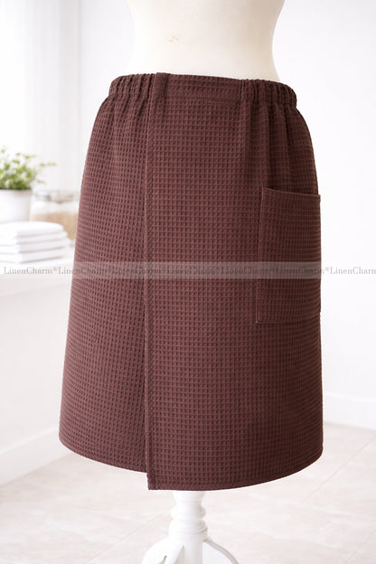 Brown checkered skirt on a mannequin against a white background