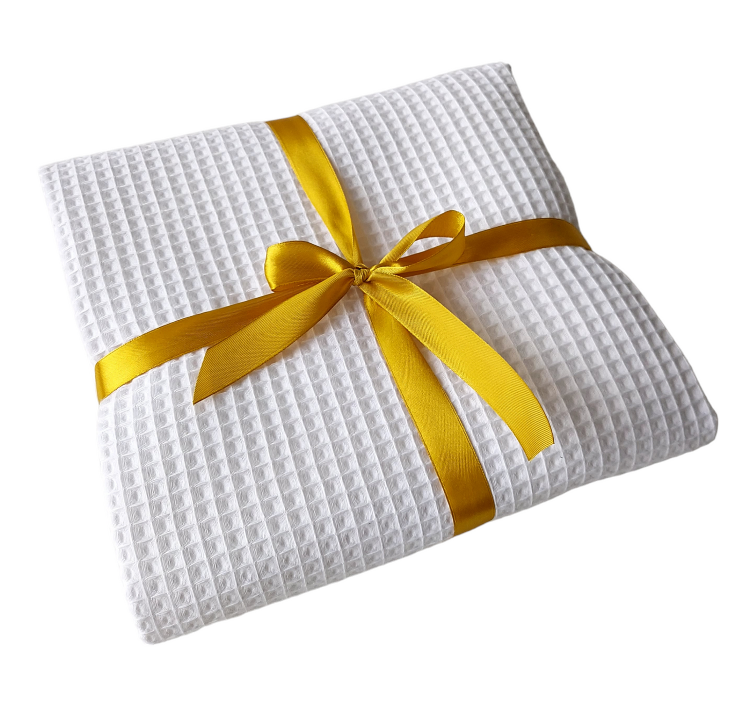 White textured blanket with a yellow ribbon on a white background